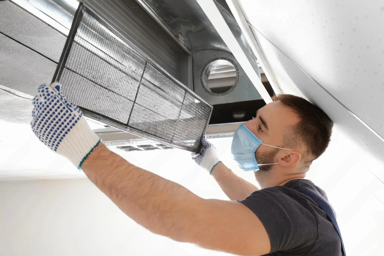 Technician cleaning air ducts with professional equipment.